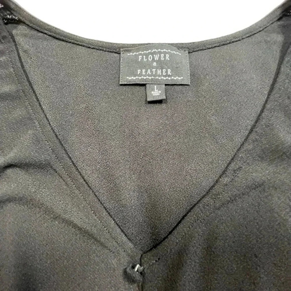 Flower and Feather Black Cinched Waist Peplum Top with Dot Lace Puffed Sleeves - Picture 4 of 5